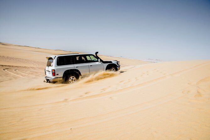 From Cairo 4x4 Safari, Camel Ride, Magic Lake, Waterfalls & Lunch - Dune Bashing and Sandboarding in Wadi El Rayan
