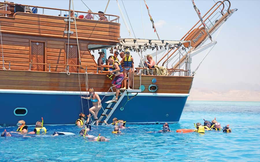 Hurghada: Pirates Sailing Boat to Orange Bay with Transfers - One hour of sailing to the reef