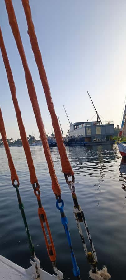Luxor: Nile River Private Sunset Felucca Ride - Boarding a traditional felucca on the Nile