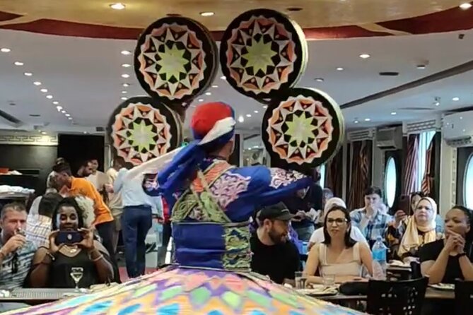 Nile Dinner Cruise in Cairo With Belly Dancing and Transfer - Belly dancing, Arabic music, and Tanoura spinning