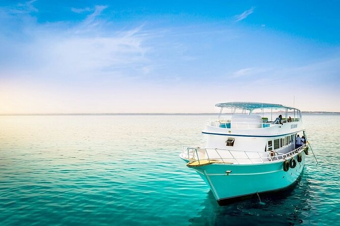 Orange Bay Island Snorkeling with Lunch & Water Sports - Hurghada - Coral reefs, colorful fish, and guided snorkeling