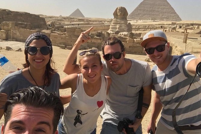 Private Tour to Giza Pyramids Sphinx with Camel Riding - Riding a camel across the Giza desert