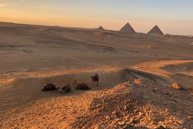 sunset at Giza pyramids by camels - A sunset ride outside the Giza pyramids area