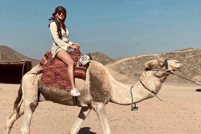 The Super Desert Safari Jeep Tour from Hurghada - Camel riding at sunset near the red dunes