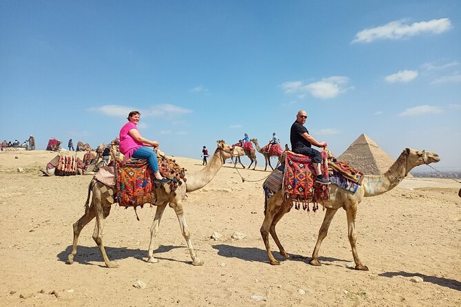 Thrilling Half-Day: Discover Pyramids, Sphinx, Camel Ride& Lunch! - The Great Pyramid of Giza, your first major stop